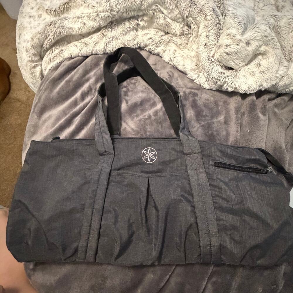 Gaiam yoga bag- holds yoga mat and essentials/clothes, lots of pockets, cute